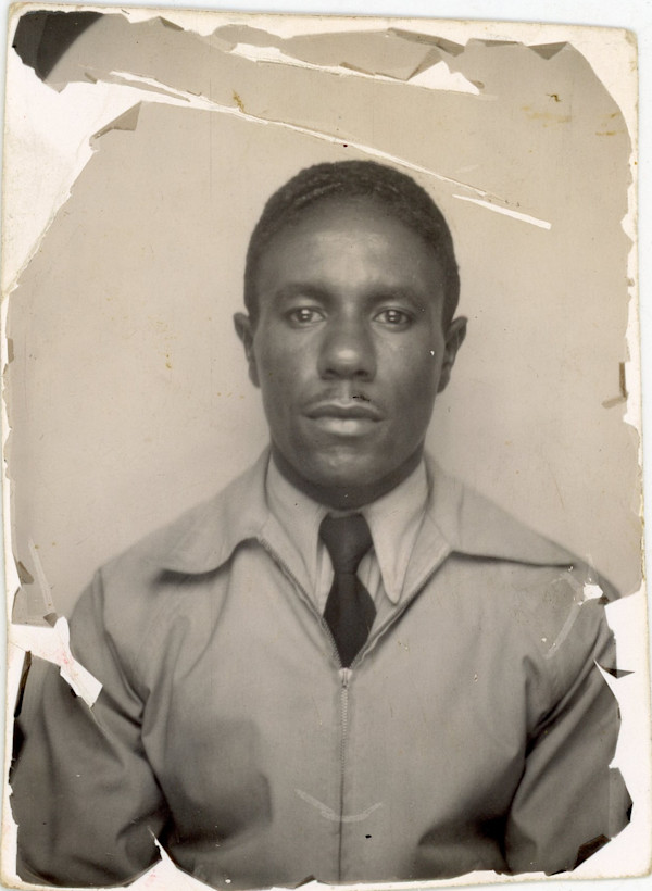 Man in zipped up jacket by Unknown