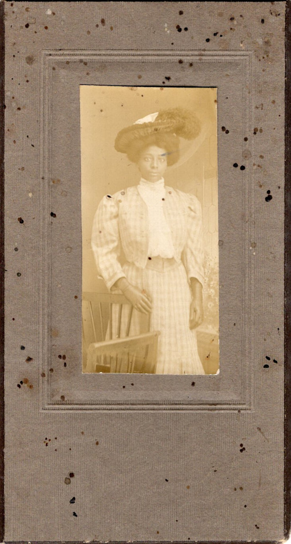 Woman in checkered suit by Unknown