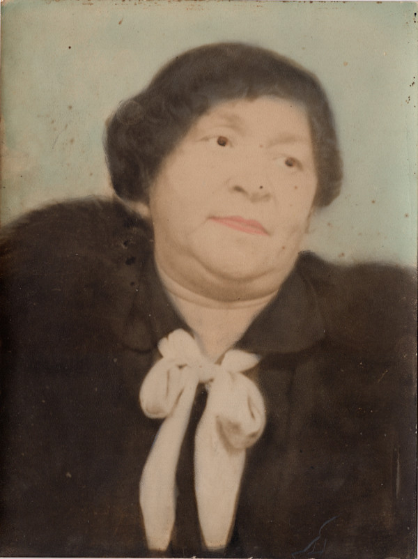 Older woman in pussybow blouse and fur by Unknown