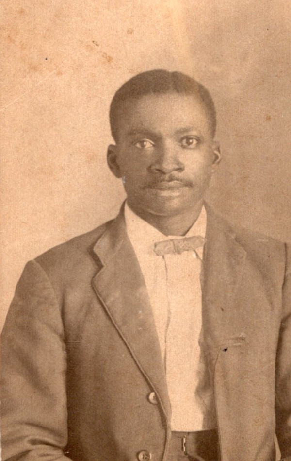 Young man wearing bow tie by Unknown