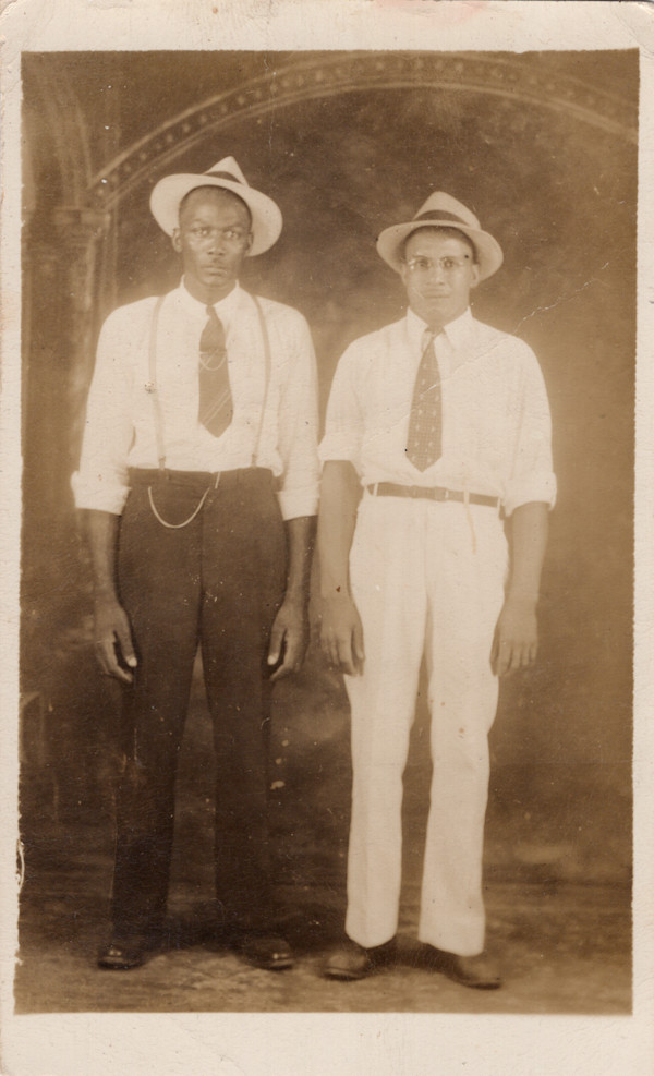 Two men in rolled shirtsleeves & hats by Unknown