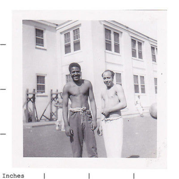 Two shirtless men by Unknown