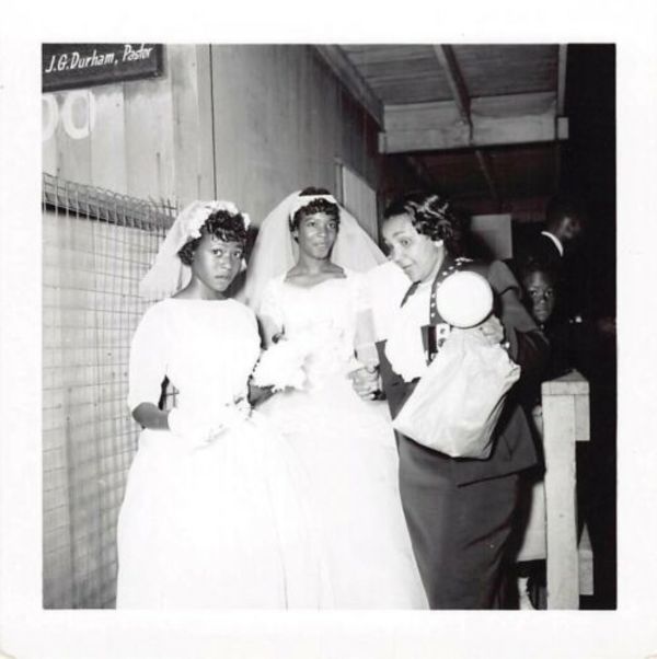 Bride and attendants at wedding by Unknown
