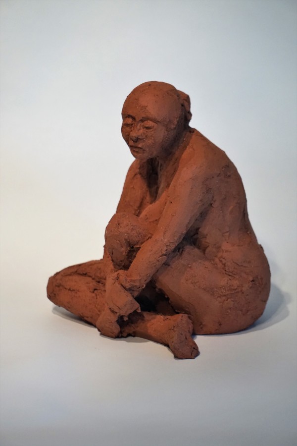 Lydia sitting by Eric Saint Georges
