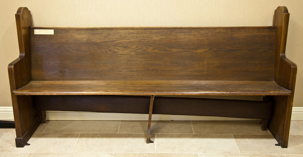 Wooden pew by Unknown