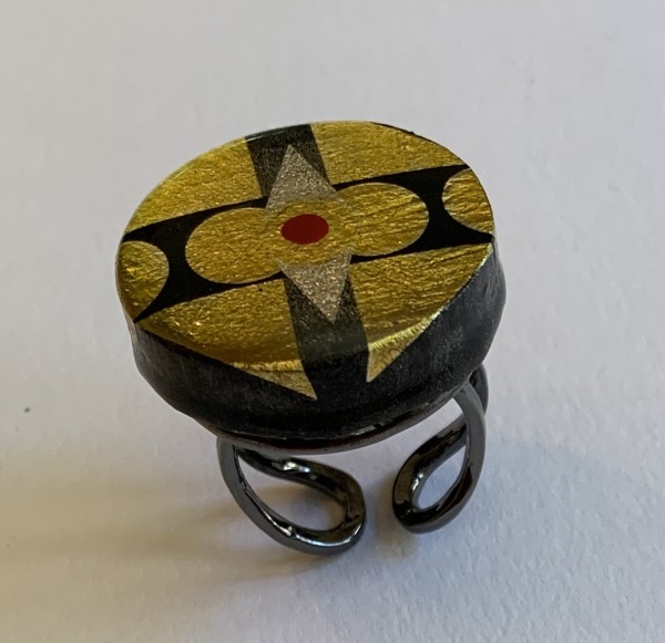 round gold and black ring by Paul Guillemette