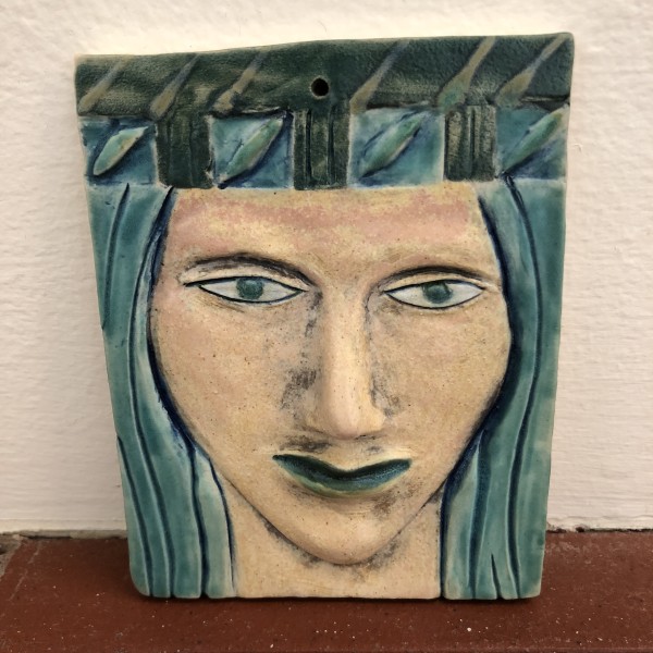 Turquena, a blue haired woman wall hanging woman, with hat by Nell Eakin
