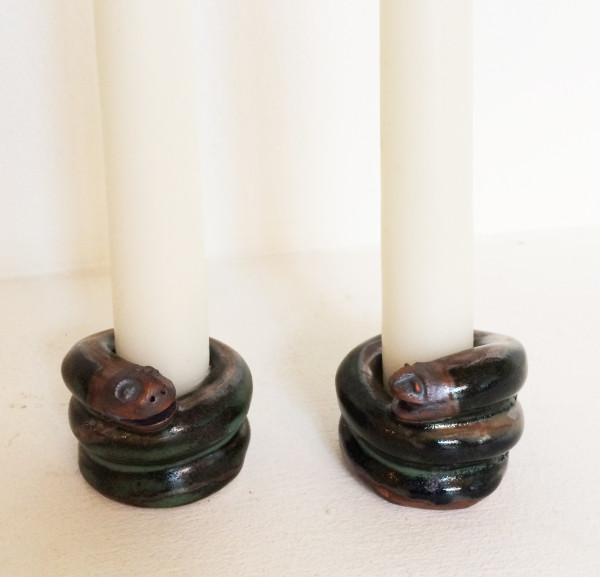 Smiling snakes coiled candle holders by Nell Eakin
