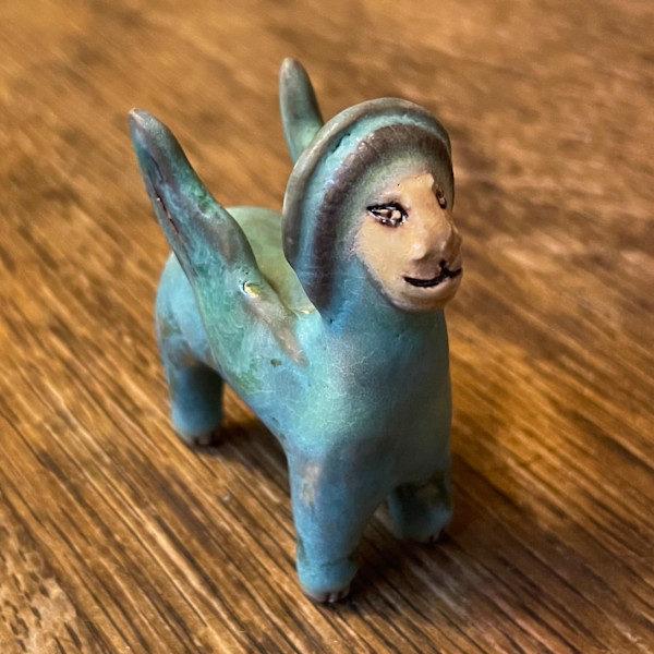 Blue Gem, a flying  teenie lion for truth and justice by Nell Eakin