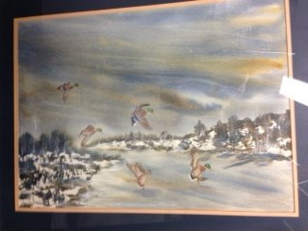 Ducks flying in snow