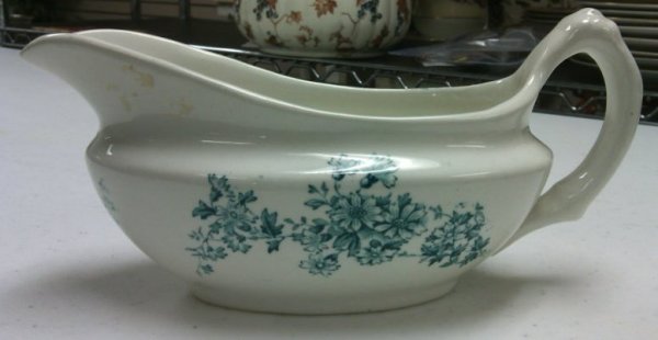 Blue and White Gravy Boat with Floral Design by Maker Unknown