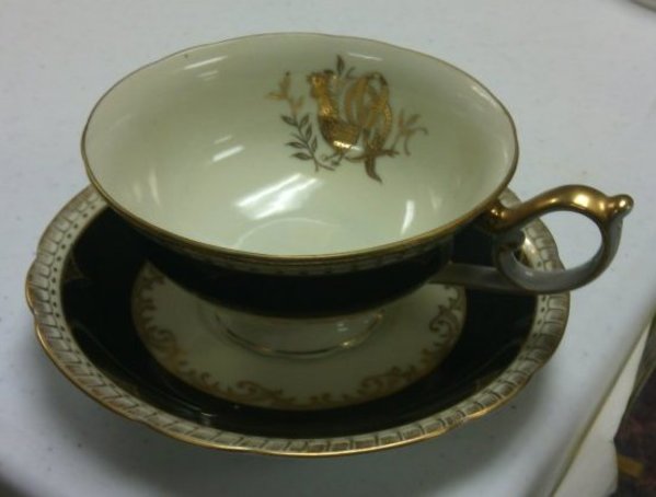 Cup and Saucer with Black and Gold Design by Del-Mar