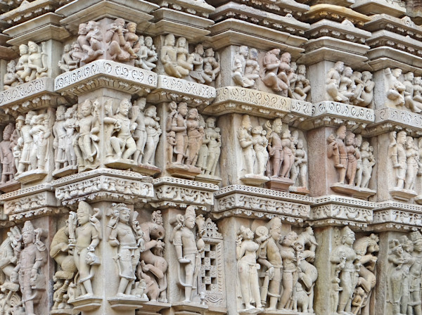 Scenes of amorous couples and celestials at Parshvanatha temple by Khajuraho Temple complex, Madhya Pradesh