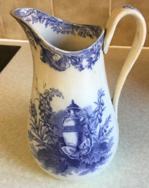 Unnamed (Butterfly & Urn) by Unknown Maker