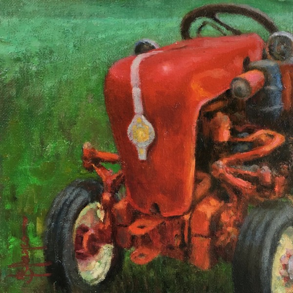 Antique red tractor by Jeannina Blanco