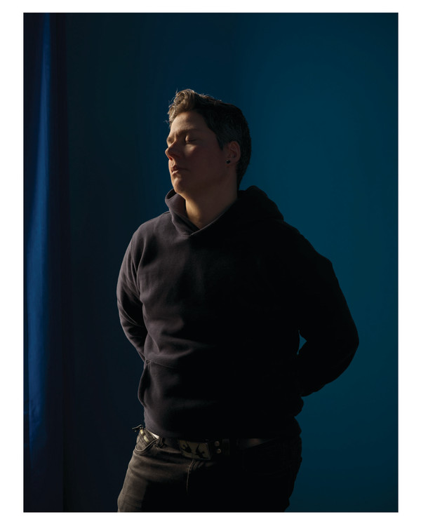 Self-portrait (blue room) by Jess Dugan