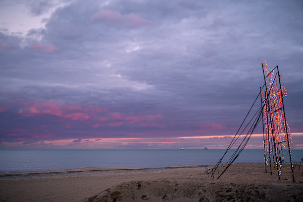 Holiday lights at sunset by Kate Brogdon
