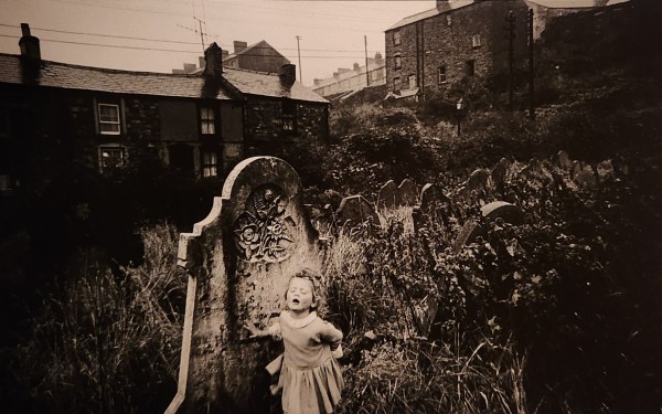 Girl Singing in a Graveyard, Wales by Bruce Davidson