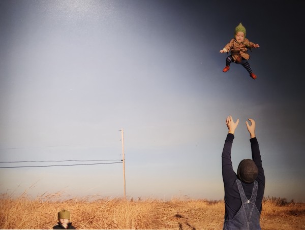 Baby Toss, 2009 by Julie Blackmon