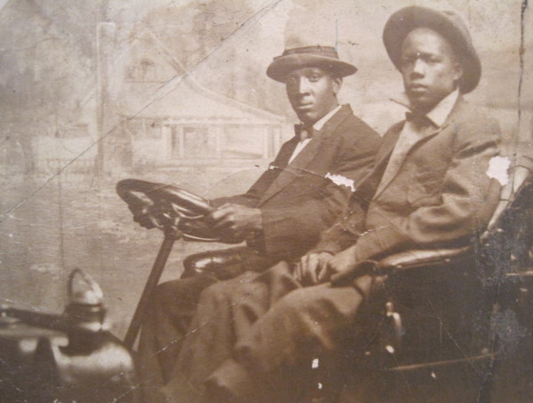 Carnival photo of men in early car