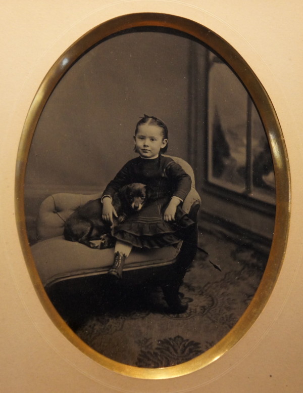 Girl with Dog on Divan