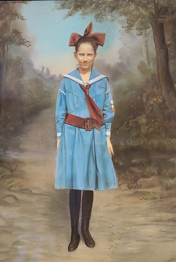 Young woman in camp uniform