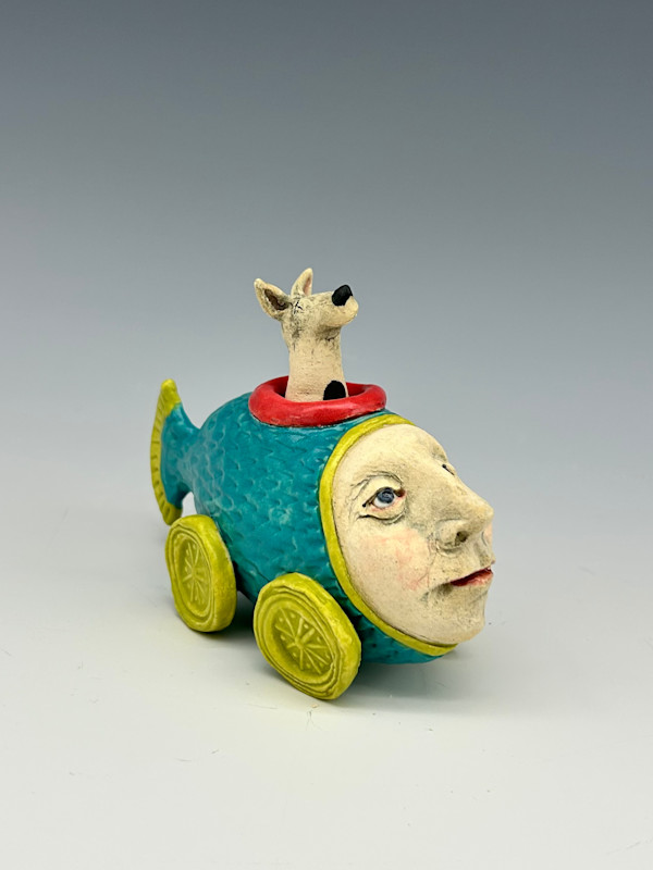 spot in a teal and green mini fish car by Jeanine Pennell