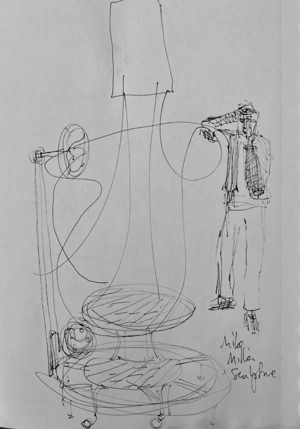 Sculpture by Mike Miller with onlooker Tim Stone by Denita Benyshek