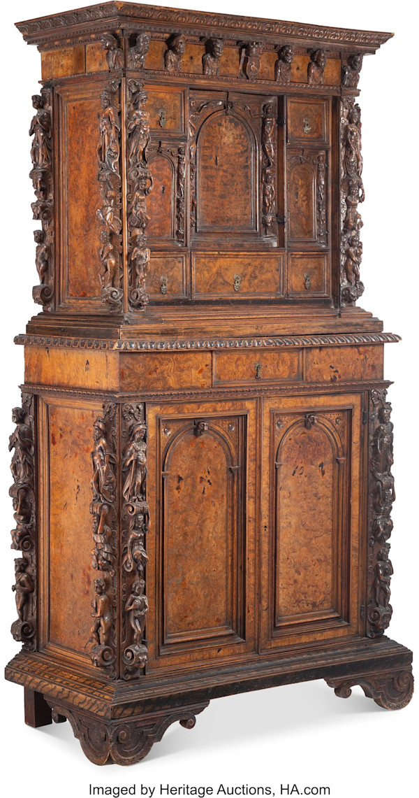 An Italian Carved Walnut Bambocci Cammode, 17th century
