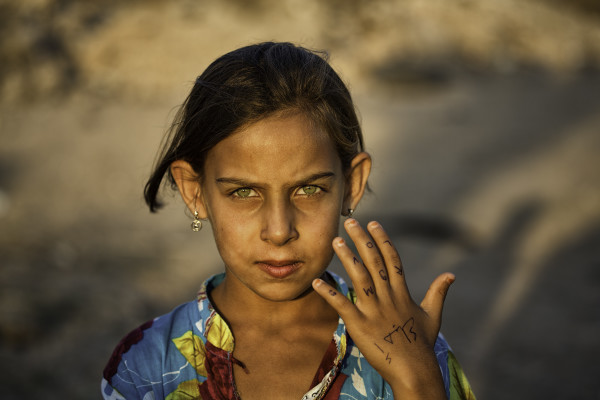 Syrian Refugee- Girl with Love on her Hand by Mimo Khair, Image 1.