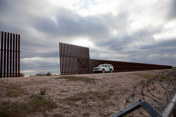 Border Wall, Border Patrol Car, and Barbed Wire (Muro fronterizo, vehículo de la Patrulla Fronter... by Susan Harbage Page
