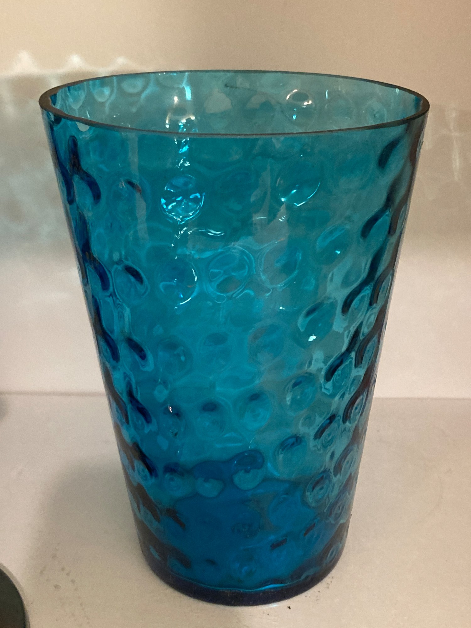 Blue art glass vase with coin dot pattern from the collection of