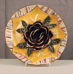 (purple flower on yellow center)