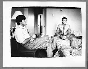 Two Unidentified Men in Hotel Room