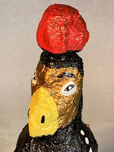 Gold face with yellow beak and red hat