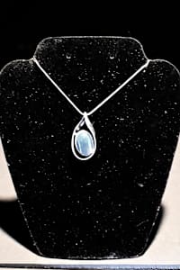 Fused dichroic glass oval twisted tear drop sterling silver pendant