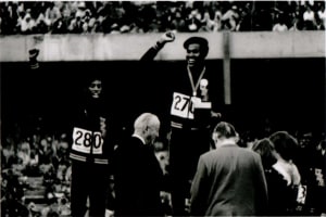 American athletes Larry James, Lee Evans and Ron Freeman (left to right) on the winner's podium for the 400-meter relay at the 1968 Olympic Games