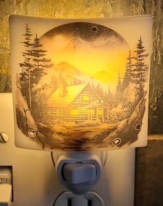 Nightlight with Cabin in Mountains
