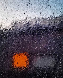 Window glass abstract, orange square and blue sky