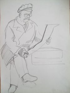 Man with a hat, reading newspaper