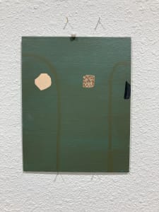 Green painting on canvas board with three shapes