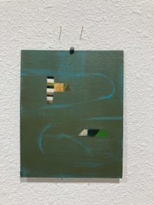 Green painting on canvas board with two shapes