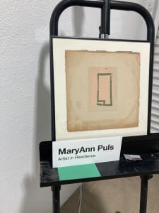 Square assemblage with small green drawing