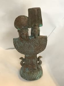 Heads of  Shu and Tefnut on a percussive instrument, a menat