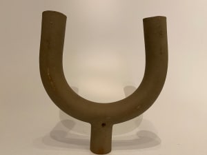 U-shaped ceramic ikebana vase on a foot