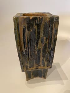Square ceramic ikebana vase on a footed base