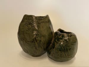 Two conjoined ceramic ikebana vases