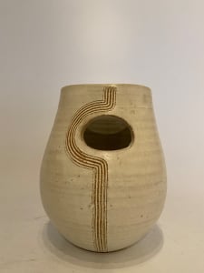 Ceramic ikebana vase with round cutout