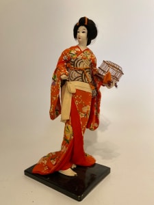 Geisha doll with birdcage