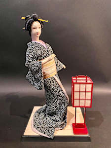 Geisha doll with lantern